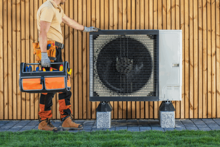 HVAC technician servicing a home system, promoting HVAC energy efficiency in Yardley PA.