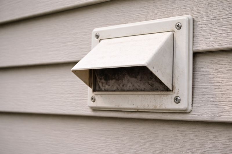 Lint buildup inside an exterior dryer vent on a residential home