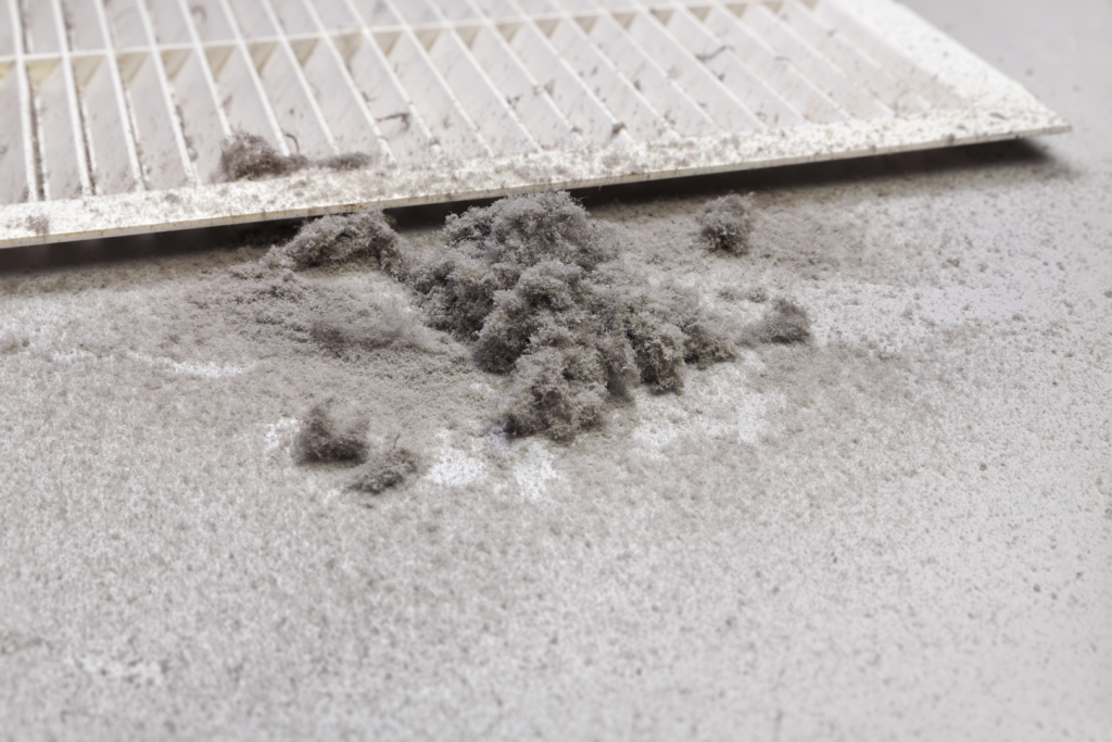Dirty air vent showing allergens and debris from contaminated duct system